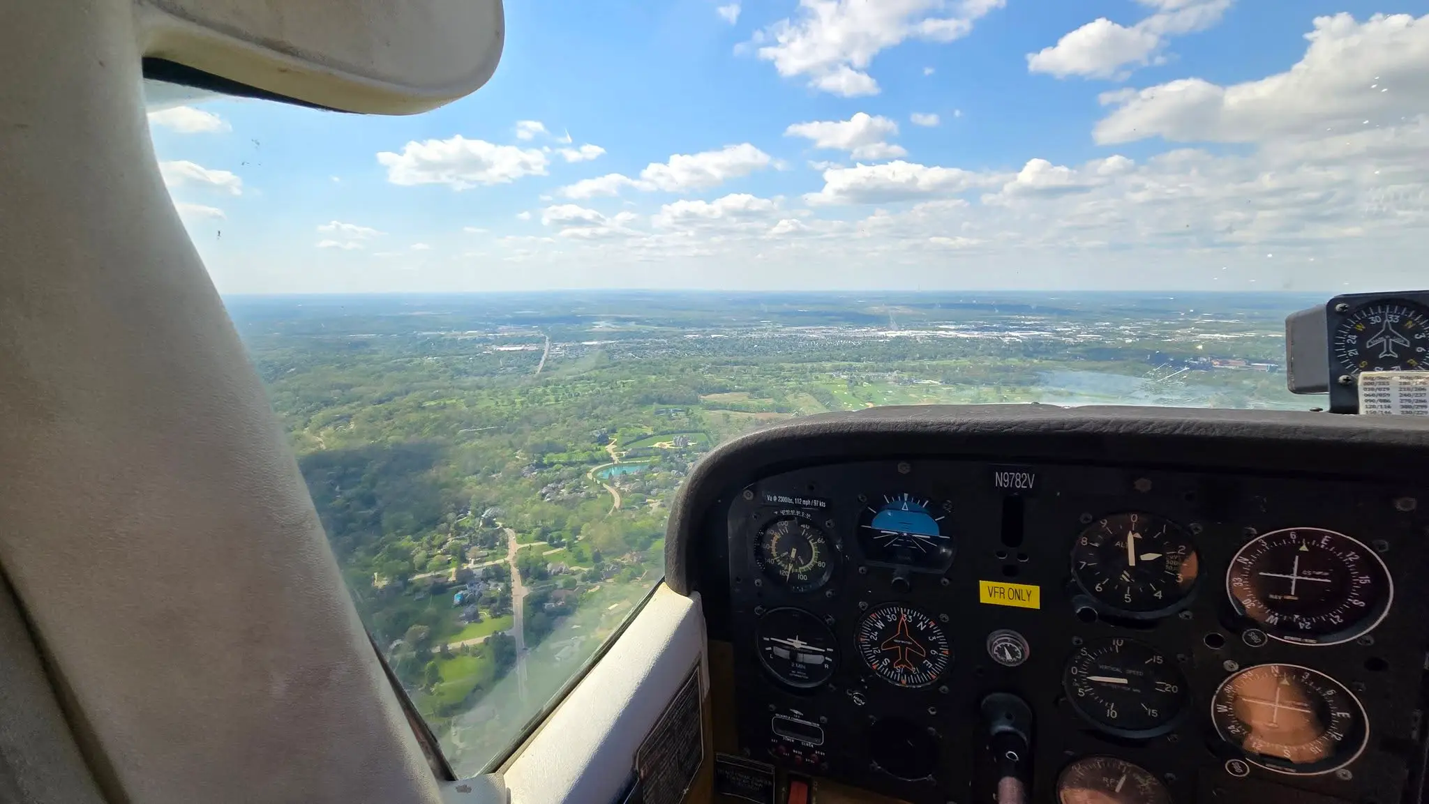 Aircraft cockpit instrument panel during flight near Moraine Airpark